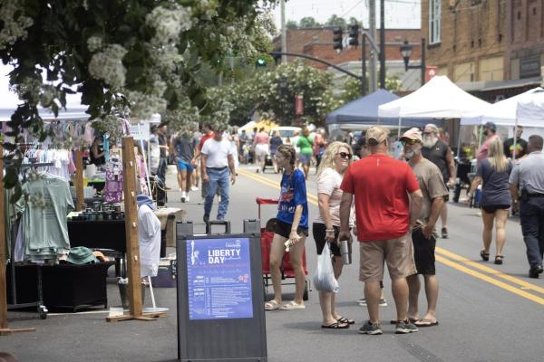 People walking down the street during Liberty Day