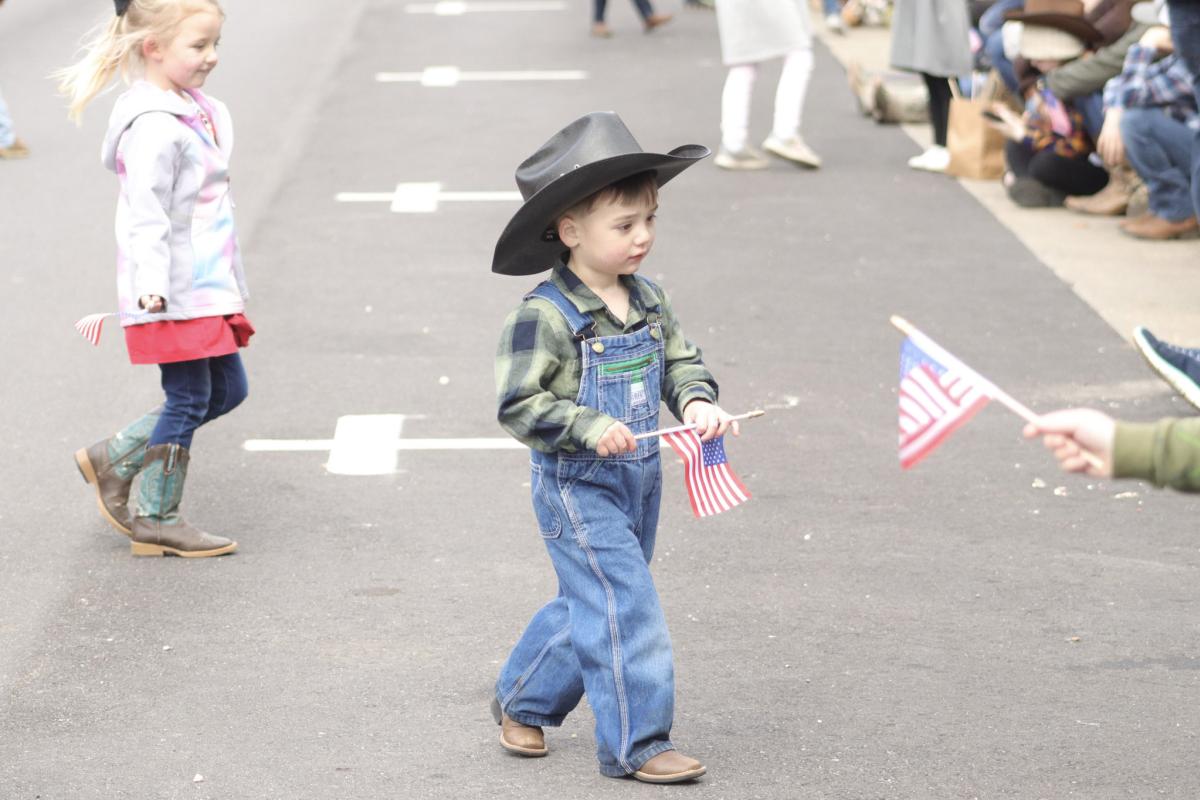 Child in Cowboy Hat in Street