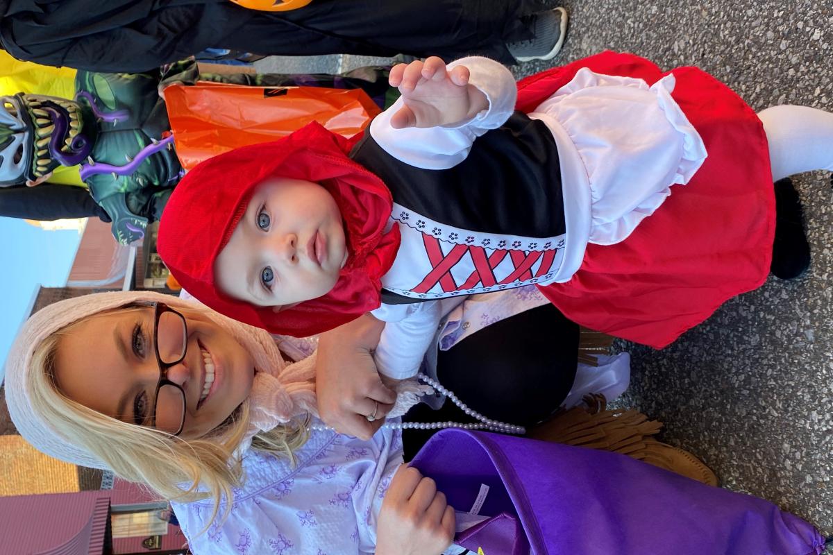Woman with child dressed in halloween costume