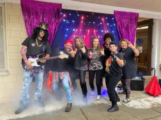 Rux Carter Insurance dressed up as a rock band for Halloween